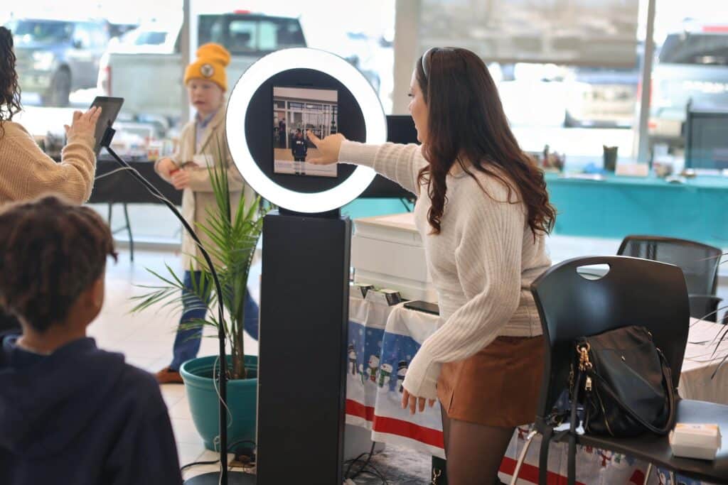 Woman engaging with the photo booth screen
