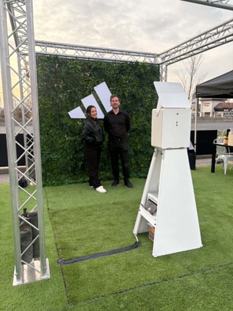 Adidas x Sport Chek Mother’s Day Run branded photo experience with Cosmo Photo Booth and green wall backdrop.